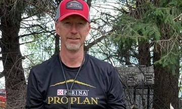 Greg Blair in a Pro Plan-branded athletic shirt