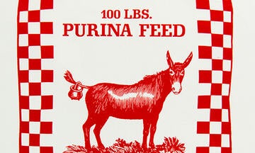 Red and white checkerboard vintage ad for Purina Feed