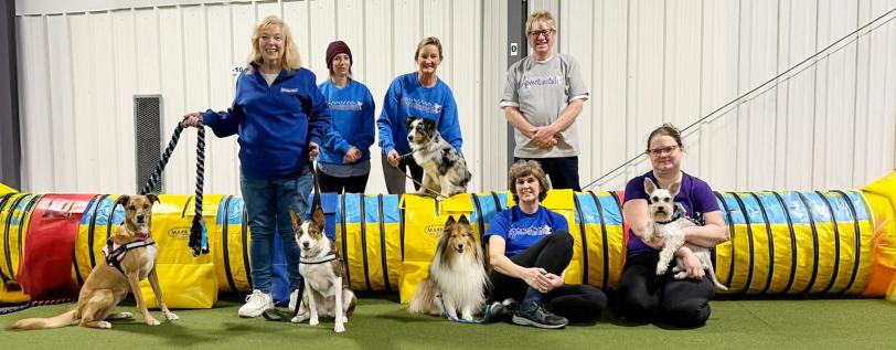 The AKC Agility League team and their dogs. 
