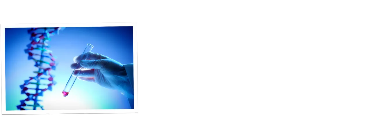 A scientist holding a test tube filled with pink liquid next to a DNA model.